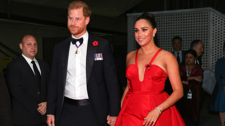 Harry and Meghan in formal attire at event