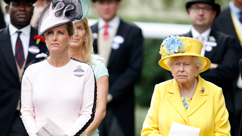 A serious-looking Duchess Sophie and Queen Elizabeth II standing next to each other