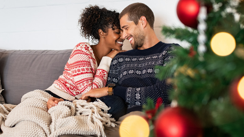 couple smiling on couch