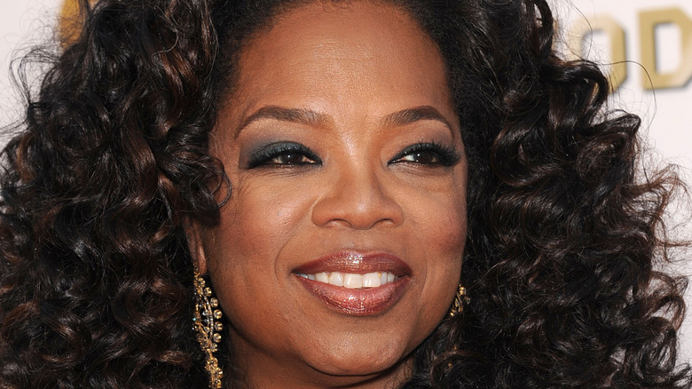 Oprah smiling for a photo