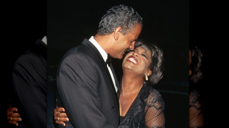 Oprah Winfrey looking up adoringly at Stedman Graham while he smiles at her