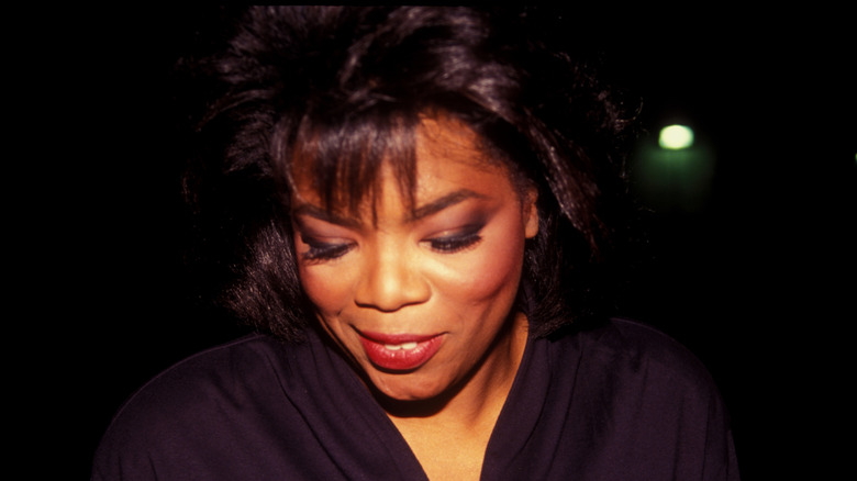 Oprah Winfrey leaving a restaurant in 1990