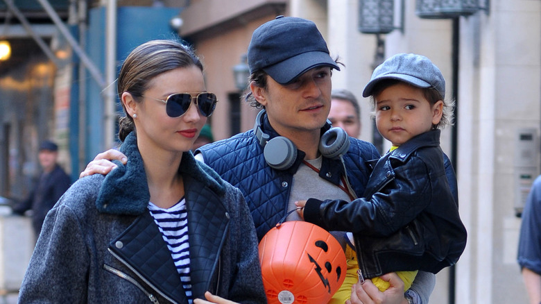 Miranda Kerr, Orlando Bloom, and son posing together in NYC.