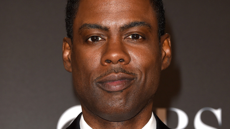 Chris Rock poses on the red carpet