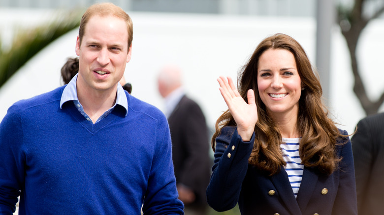 Prince William and Kate Middleton waving and walking