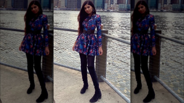 woman wearing dress with boots and tights