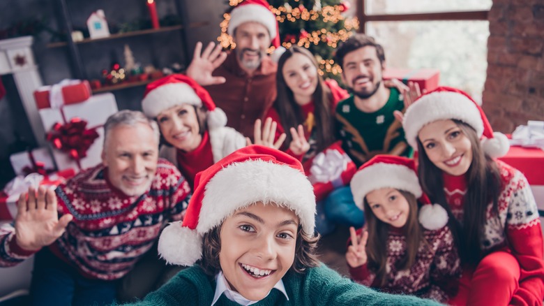 A smiling family in a Christmas selfie 