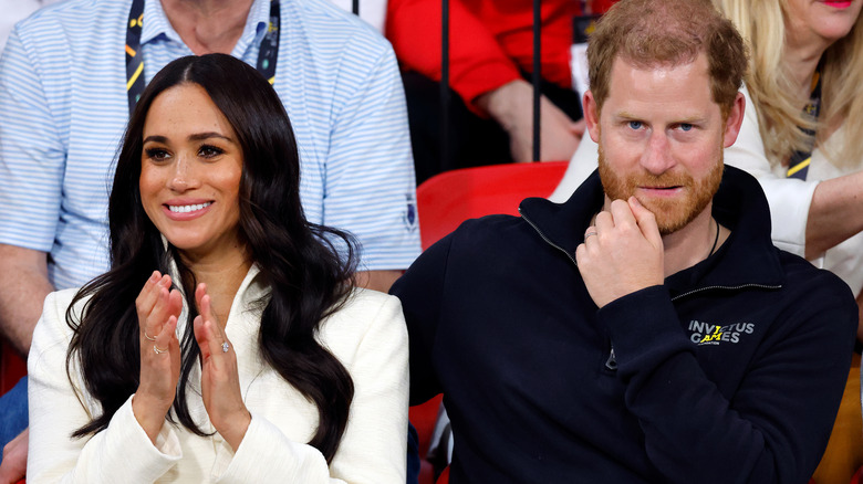 Meghan Markle and Prince Harry sitting in audience