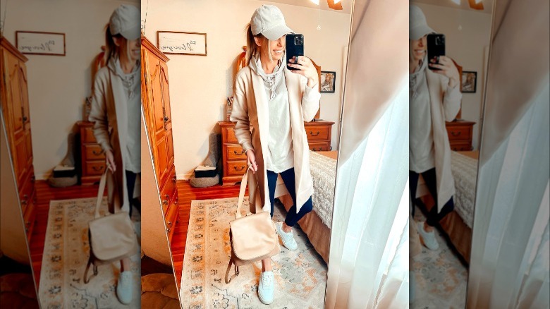 Woman in cream trench coat outfit