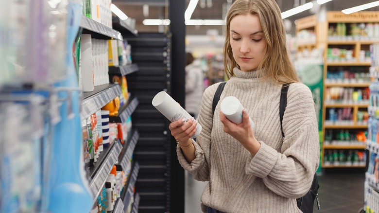 Woman shops for shampoo