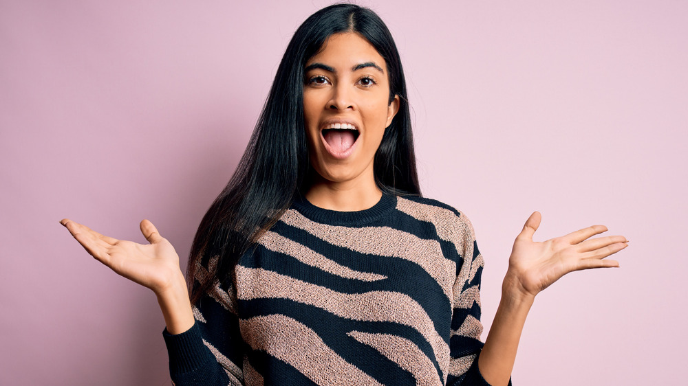 Woman wearing an animal print sweater 