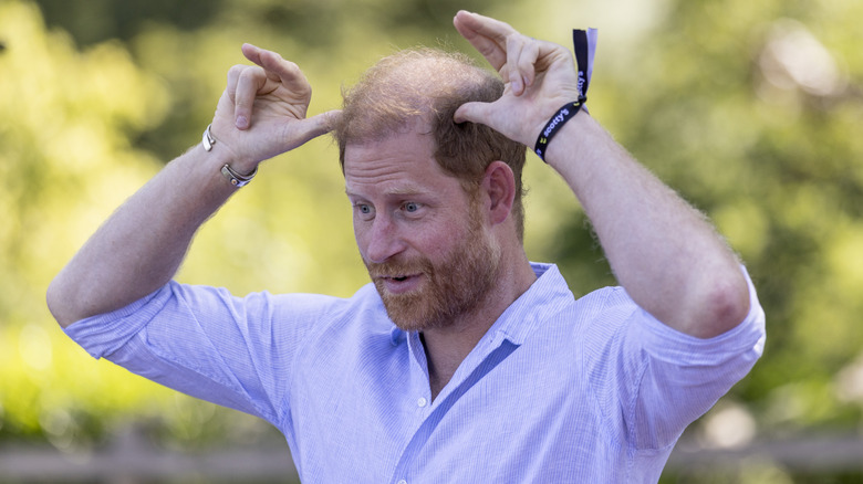 Prince Harry doing a silly gesture