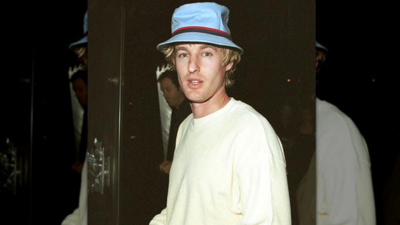 A younger Owen Wilson wearing a bucket hat