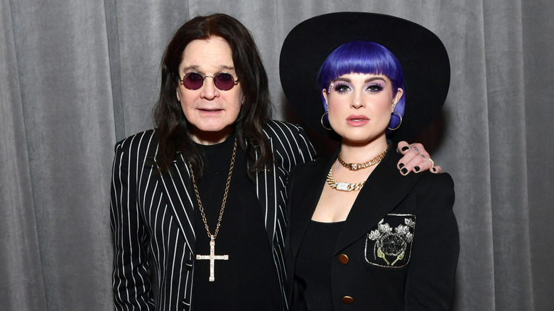 Ozzy Osbourne puts his arm around Kelly Osbourne