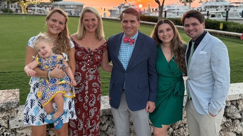 Kristine and Todd Blanche posing for a a photo with their children and grandchildren.