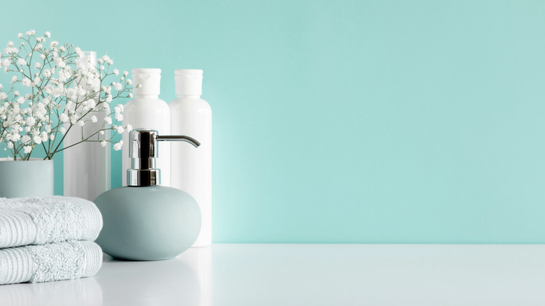Bathroom counter in front of blue wall
