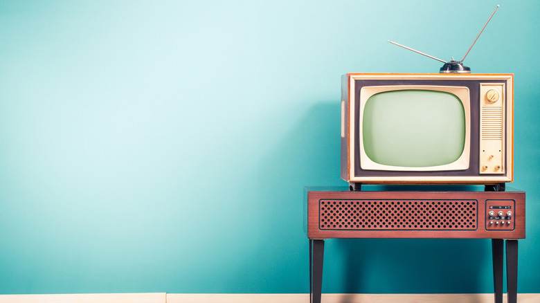 Television on a light blue background