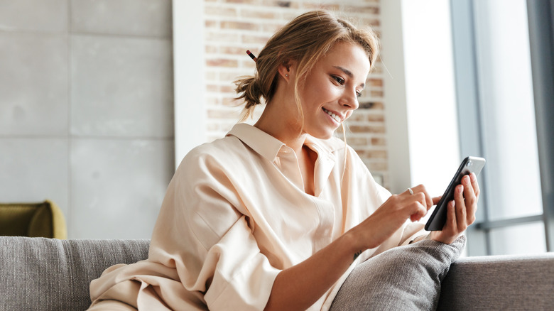 Woman in pajamas working