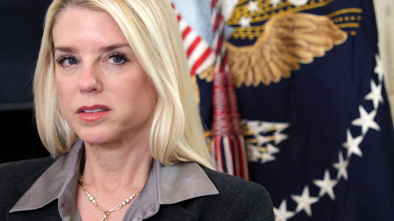 Pam Bondi looking incredibly displeased while giving someone some shady side-eye