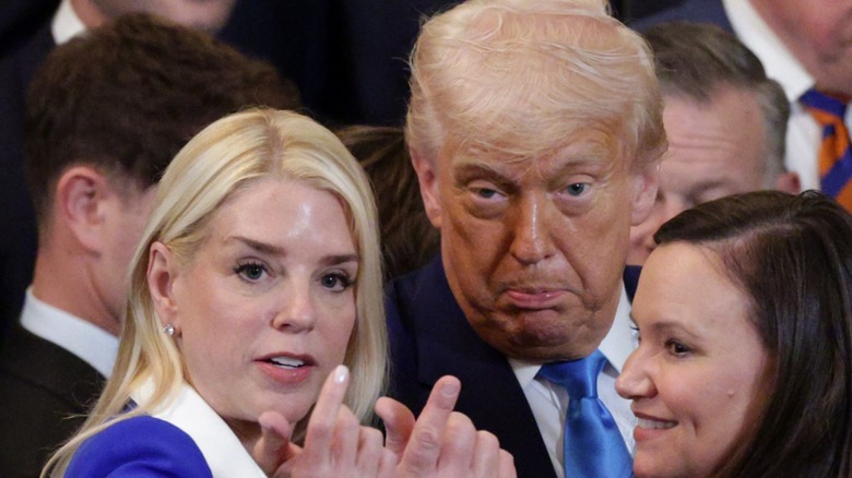 Pam Bondi and Donald Trump gesture during a ceremony in the East Room of the White House (2025)
