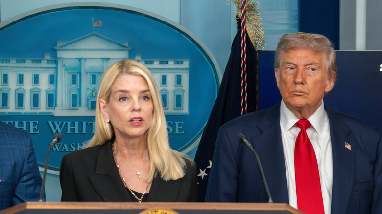 Pam Bondi and President Donald Trump speaking at the White House