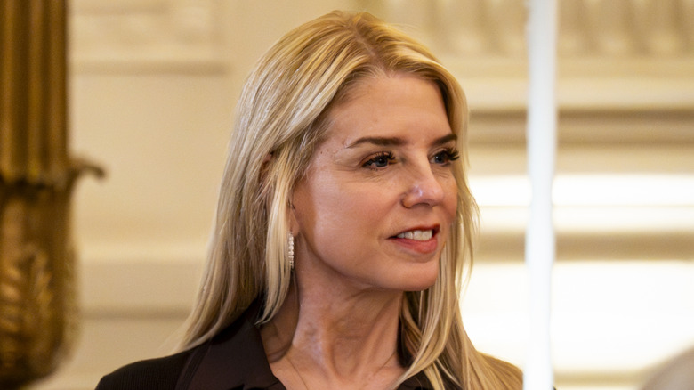 Closeup side profile of Pam Bondi smiling