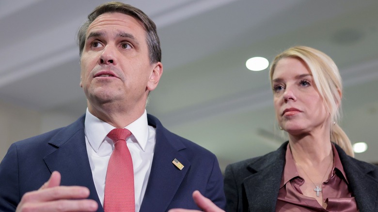 Todd Blanche and Pam Bondi speak with the media