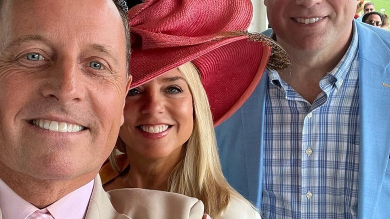 Pam Bondi poses between friends at the Kentucky Derby (2022)