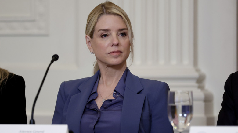 Attorney General Pam Bondi listens as U.S. President Donald Trump speaks during a lunch with the Trump Kennedy Center Board Members in the East Room of the White House on March 16, 2026 in Washington, DC.