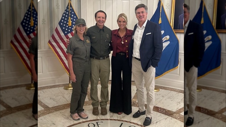 Pam Bondi smiling with a group of people
