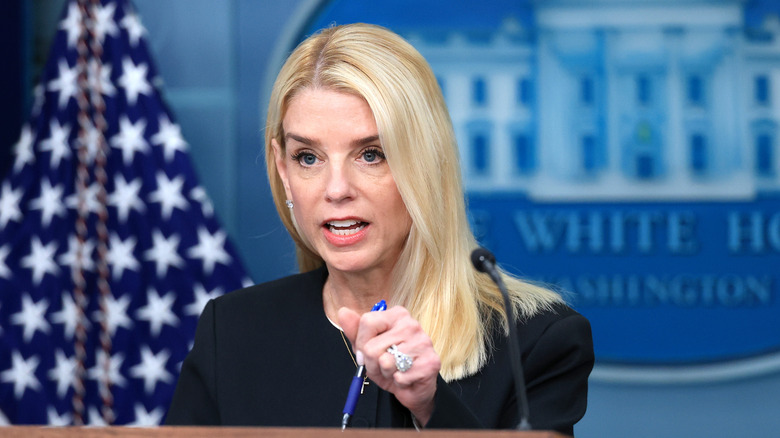 Pam Bondi talking at podium
