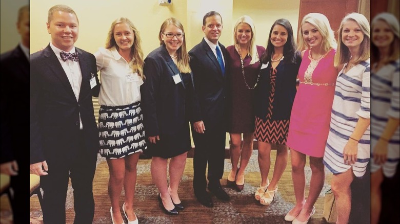 Pam Bondi posing with others
