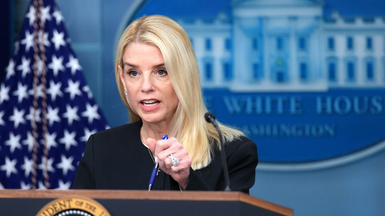 Pam Bondi talking at podium