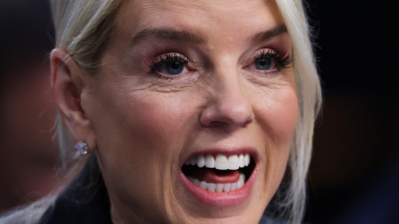 Pam Bondi with mouth open staring ahead
