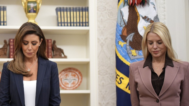 Alina Habba and Pam Bondi praying
