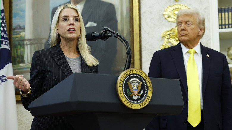 Donald trump scowling at Pam Bondi as she talks