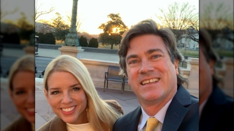 Pam Bondi and John Wakefield pose together outside the Library of Congress (2019)