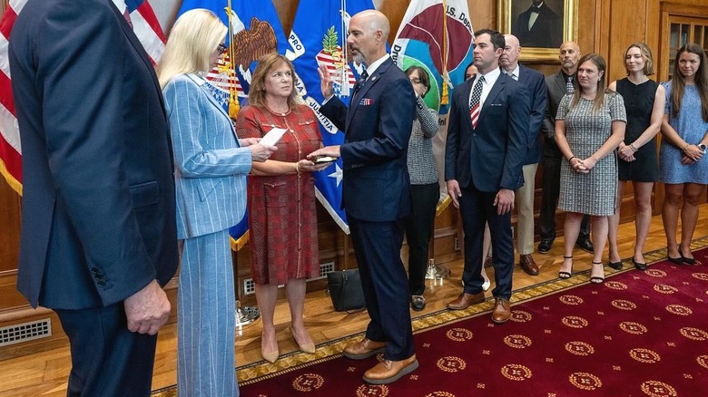 Pam Bondi light blue pinstripe swearing in Terry Cole
