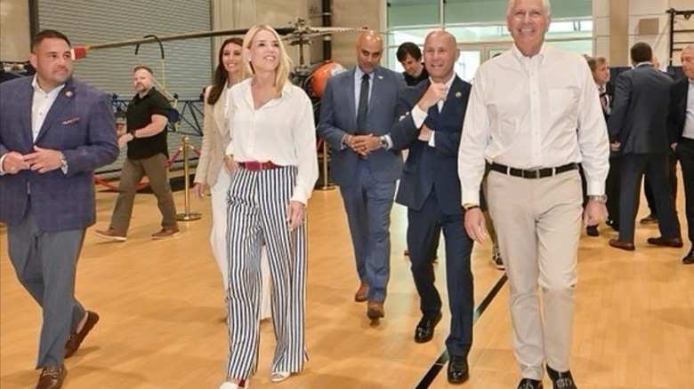 Pam Bondi striped pants at police training village