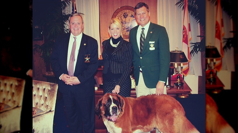 Pam Bondi with Saint Bernard and two sheriffs