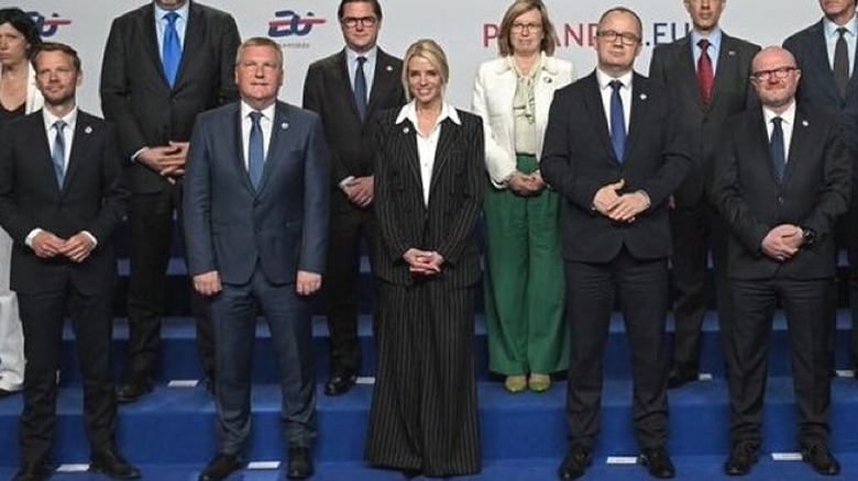 Pam Bondi pinstripe suit with EU partners