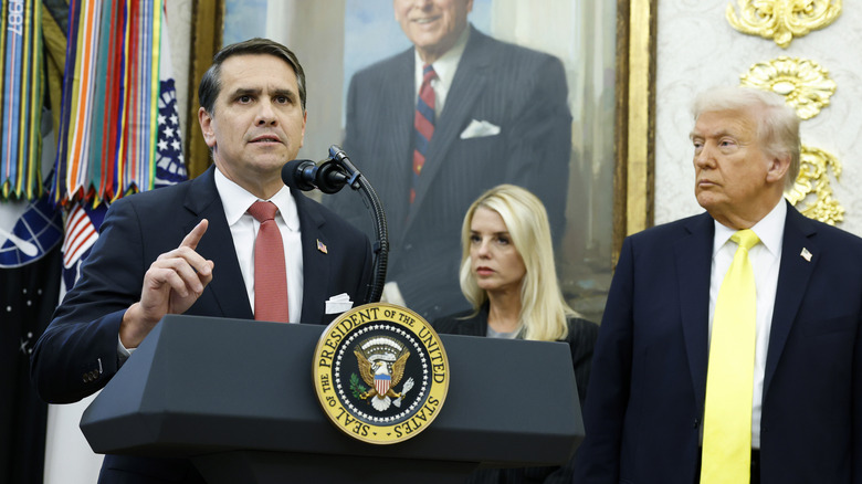 Todd Blanche speaking at the White House with Donald Trump and Pam Bondi behind him