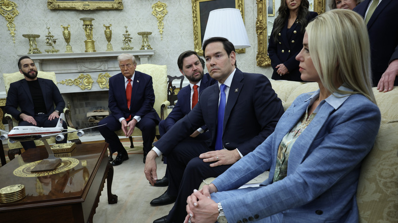 Pam Bondi sits in the Oval Office with several members of the Trump administration