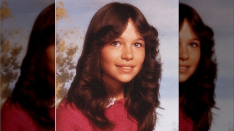 A young Pamela Anderson smiles