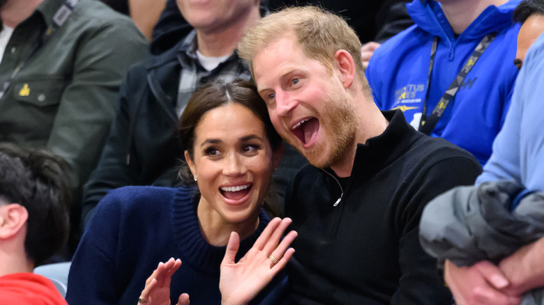 Harry and Meghan watching a basketball game at the Invictus Games