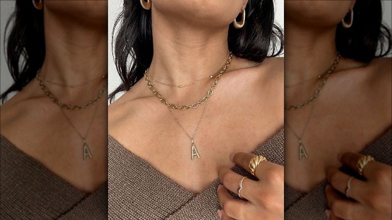 Mejuri's chunky paper clip chain layered with other necklaces