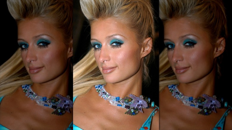 Paris Hilton smiling with electric blue eyeshadow