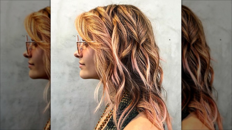 Paris Jackson looking off to the side with pink highlights