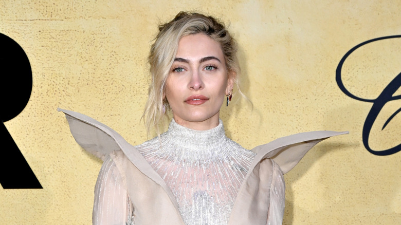 Paris Jackson smiling at the amfAR Cannes Gala in 2025