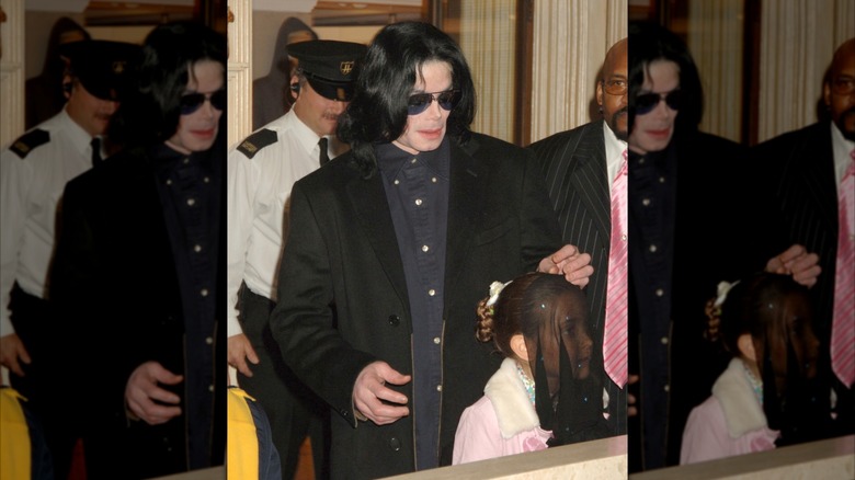 Michael Jackson walking with Paris Jackson in England in 2005